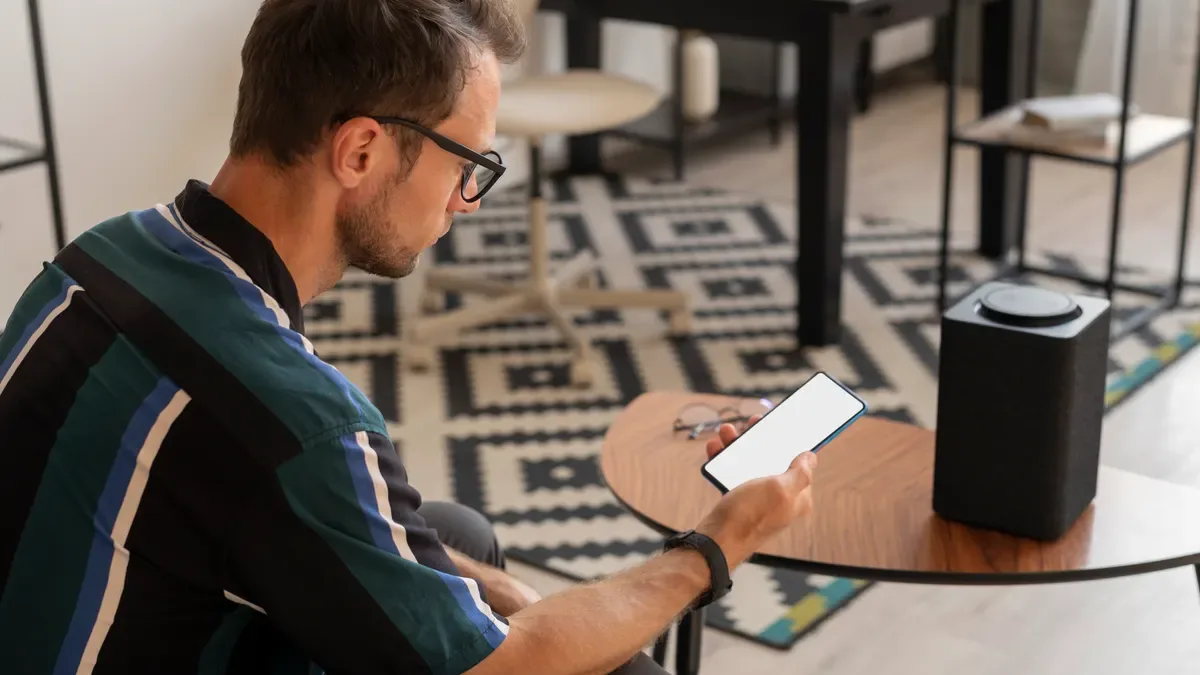 A business owner checking a message on a phone